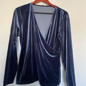 Stretch velvet wrap top in indigo blue.